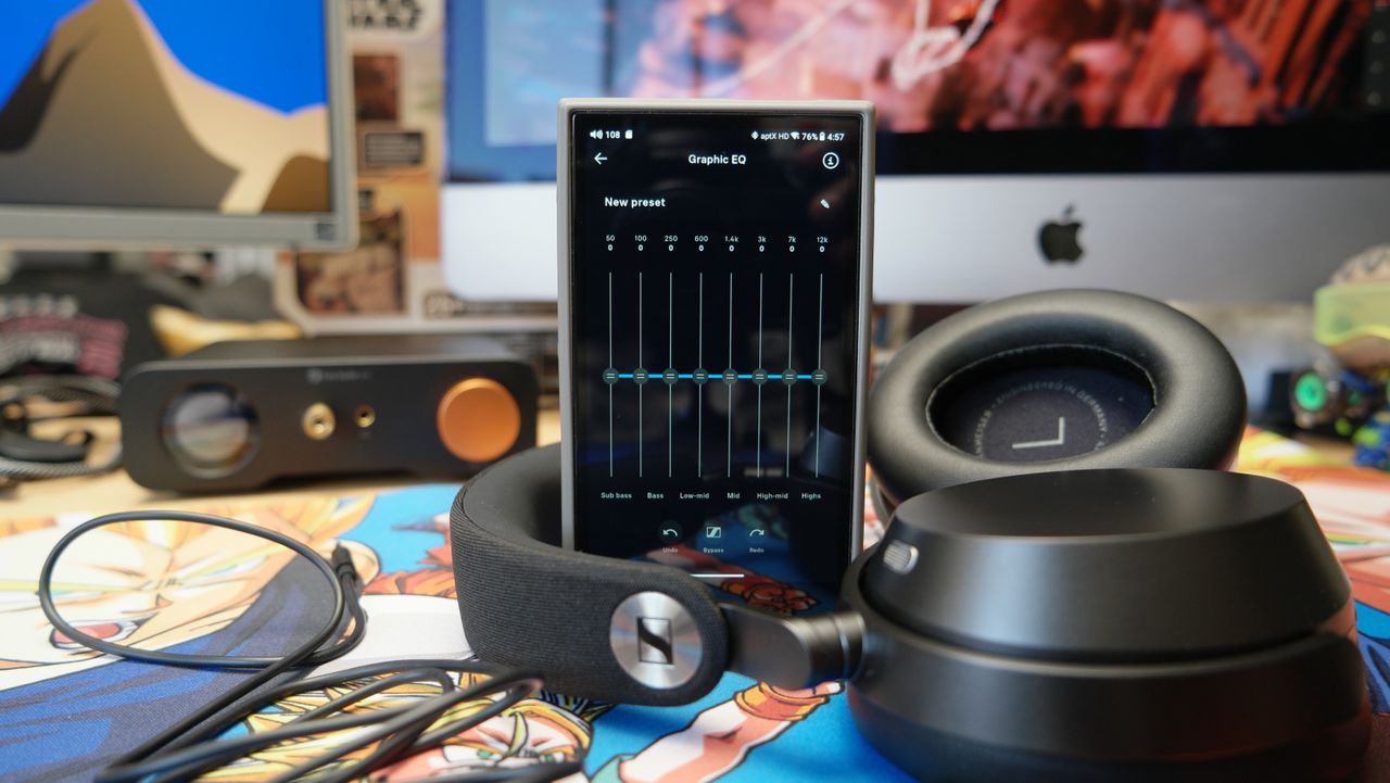 Sennheiser Momentum 5 headphones on a desk with a FiiO M21 DAP