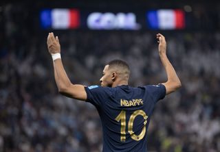 Kylian Mbappé celebrates after scoring his third goal for France against Argentina in the 2022 World Cup final.