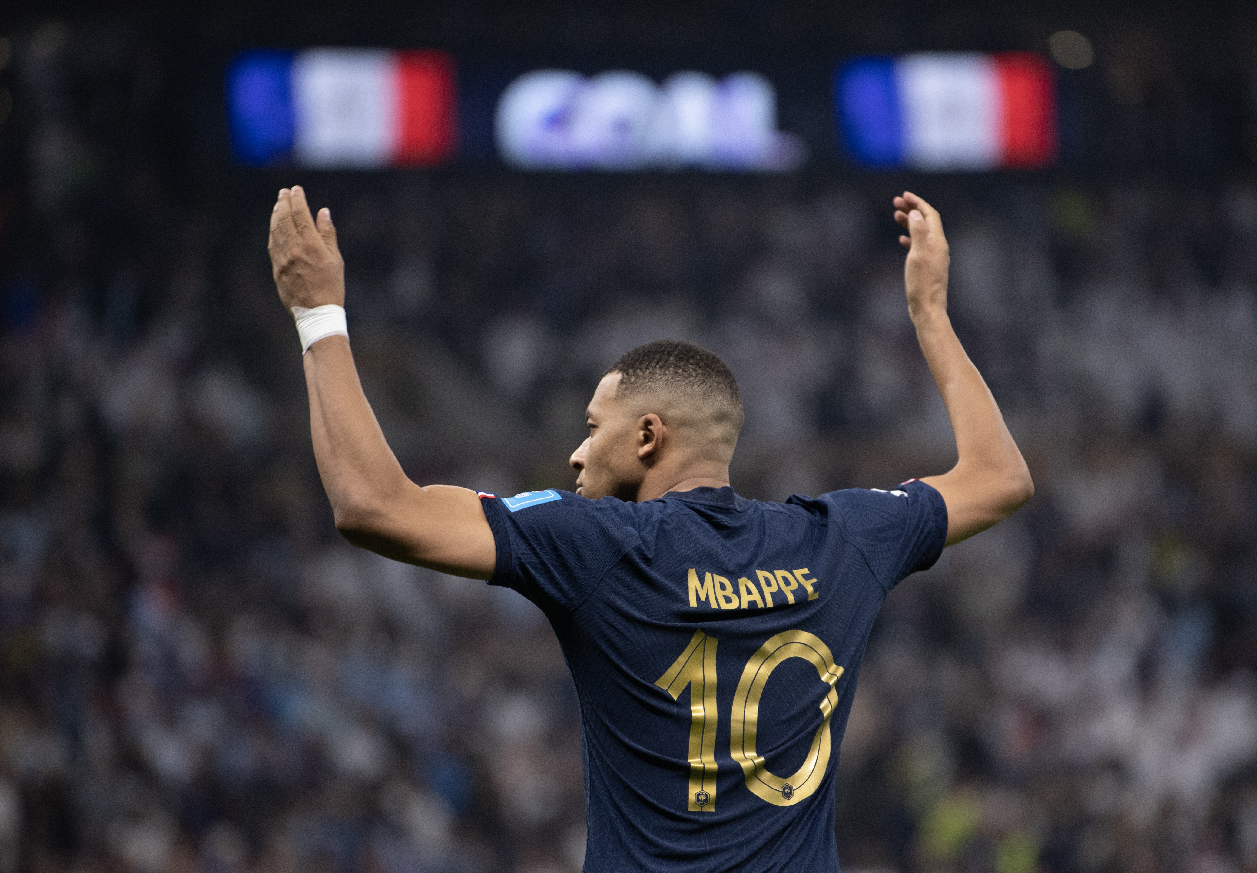 Kylian Mbappé celebrates after scoring his third goal for France against Argentina in the 2022 World Cup final.