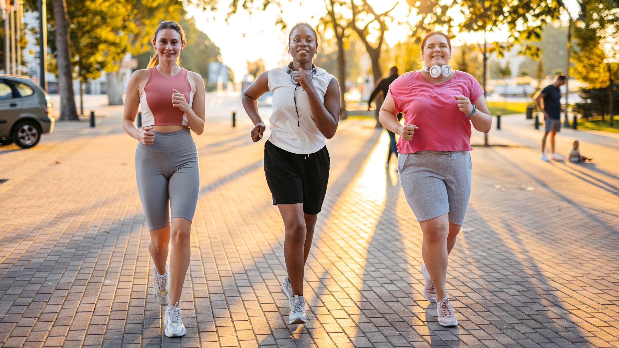 Three women in a line walking briskly