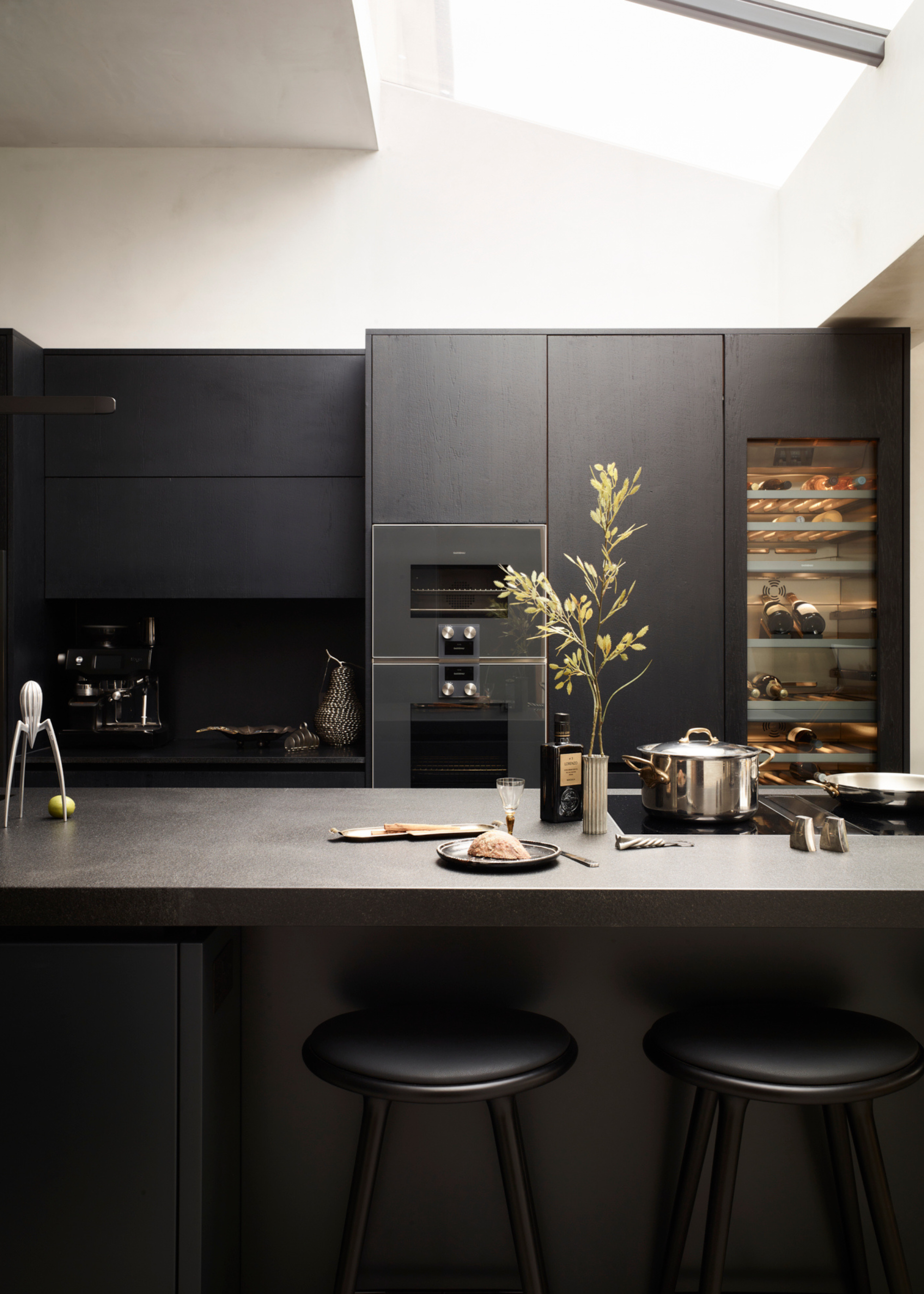 stunning all black sleek kitchen design with skylight