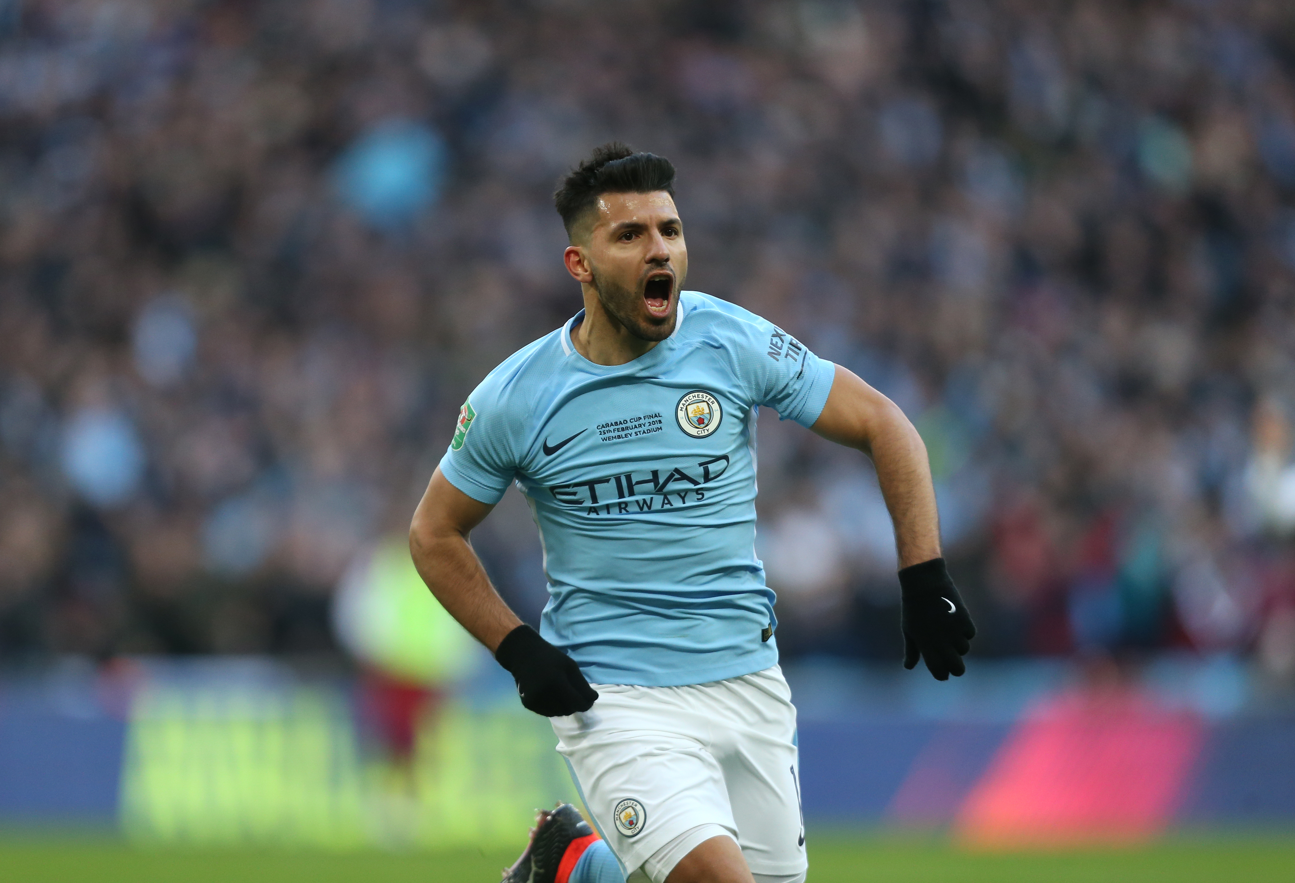 Sergio Aguero celebrates after scoring for Manchester City against Arsenal in the 2018 League Cup final.