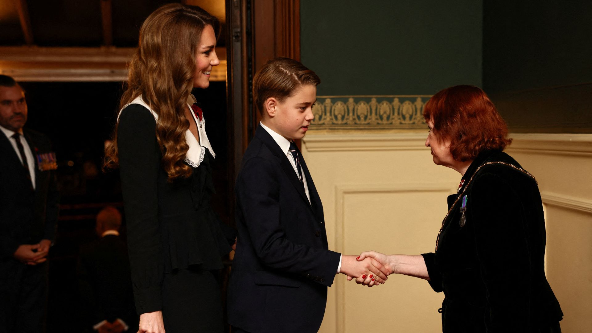 Kate Middleton with Prince George as he shakes hands at the Festival of Remembrance 2025