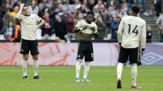 Manchester United players look dejected after West Ham scored their second goal at the London Stadium