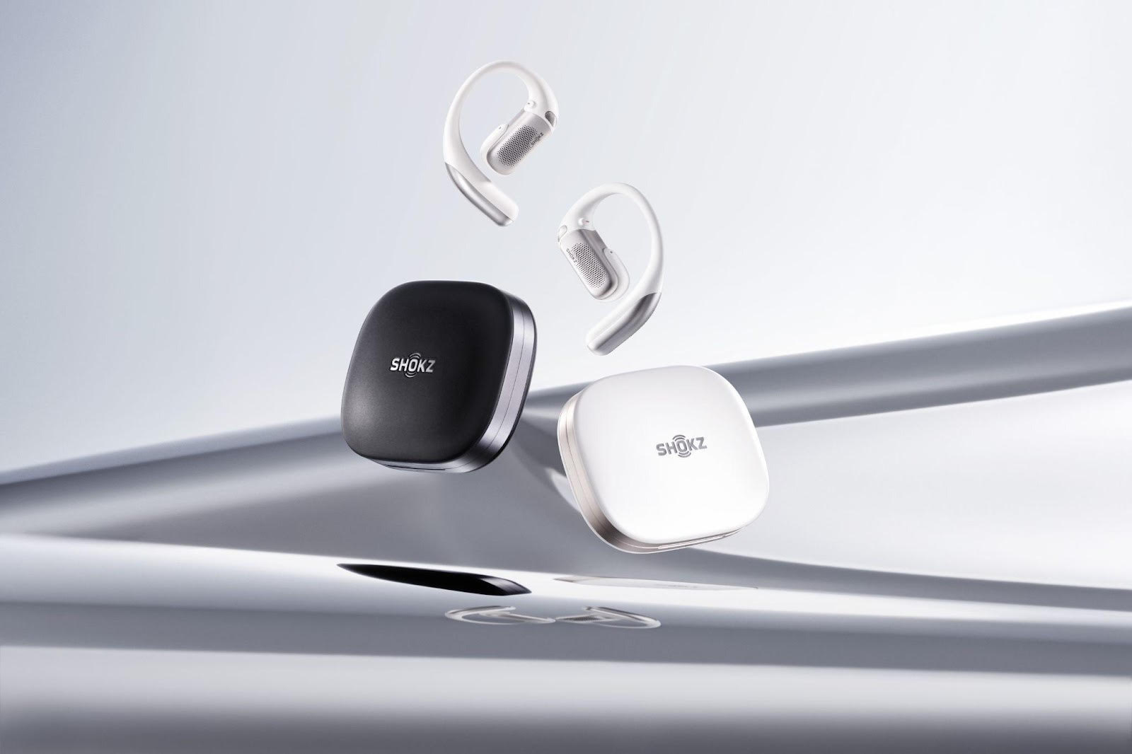 Shokz OpenFit Pro wireless earbuds in white and black