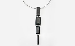 Necklace pendant with black stones