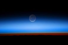 An image taken from the International Space Station in 2011 shows Earthshine on the moon.