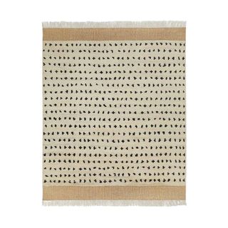 Neutral rug with black spots
