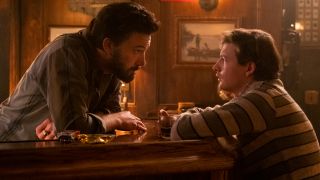 Ben Affleck talks to Tye Sheridan from behind the bar in The Tender Bar.