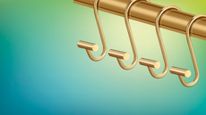 gold s-hooks on a colorful background