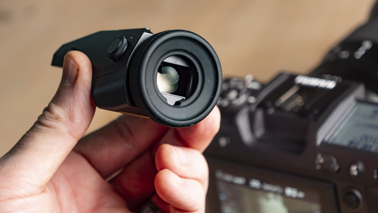 Fujifilm GFX100 II removable viewfinder in the hand