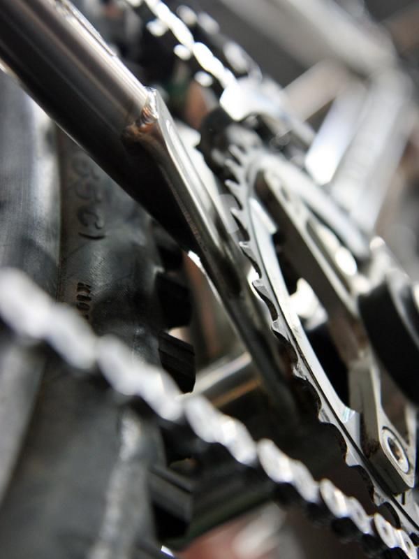 Vertigo Cycles principal Sean Chaney says this titanium plate-style chain stay section is the best way to get all the tire and chainring clearance he was looking for.