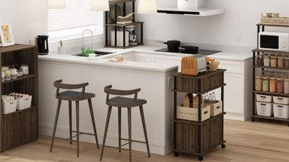 A modern farmhouse kitchen with set of wooden bar stools, kitchen storage, and white kitchen peninsula from Walker Edison, one of the best Amazon furniture brands