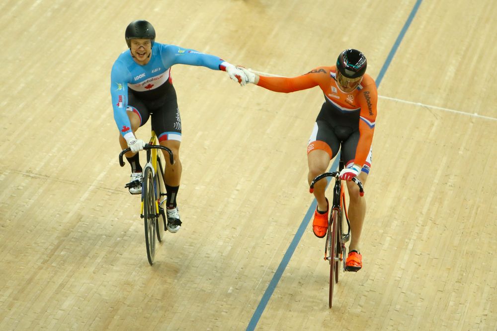 Barrette Hugo of Canada shakes hand with Buchli Matthijs of Netherland after Buchli Matthijs won the Men's Keirin Final