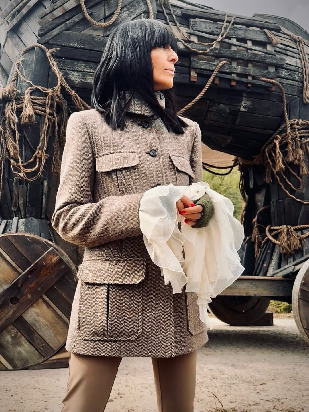 Claudia Winkleman wearing beige blazer