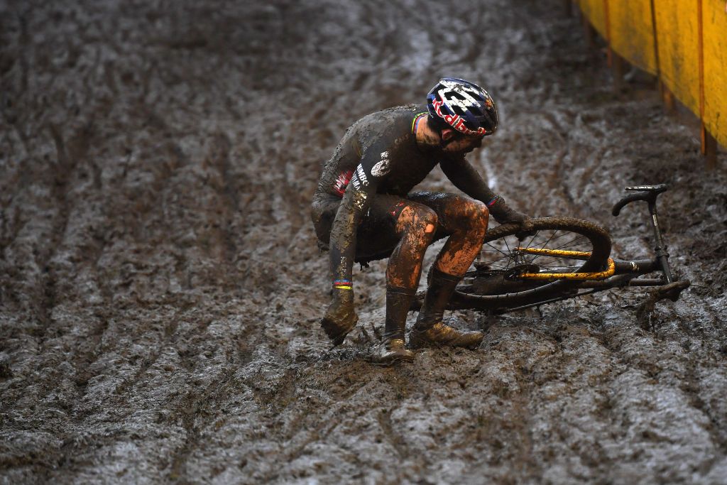 BOOM BELGIUM DECEMBER 04 Wout Van Aert of Belgium and Team Jumbo Visma falls on a muddy sector during the 7th Superprestige Cyclocross Boom 2021 Mens Elite SPBoom Superprestige2022 on December 04 2021 in Boom Belgium Photo by Luc ClaessenGetty Images