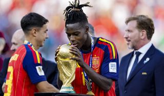 Nico Williams of Spain kisses the winner's trophy following the FIFA World Cup 2026 Final against Argentina at New York New Jersey Stadium on July 19, 2026 in East Rutherford, United States