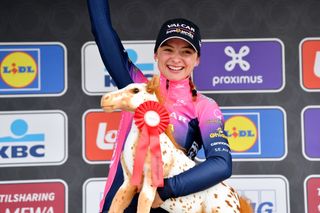 WAREGEM BELGIUM MARCH 30 Chiara Consonni of Italy and Valcar Travel Service Team celebrates winning the race on the podium ceremony after the 10th Dwars door Vlaanderen 2022 Womens Elite a 120km one day race from Waregem to Waregem DDV22 DDVwomen on March 30 2022 in Waregem Belgium Photo by Luc ClaessenGetty Images