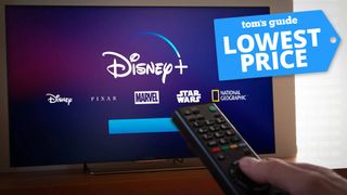 Remote pointed at a television with Disney Plus splash screen and a Tom's Guide deal tag