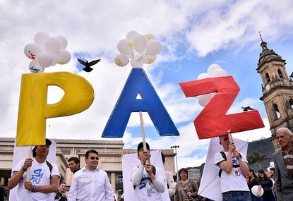 Colombians celebrate their country's peace agreement between the government and FARC rebels
