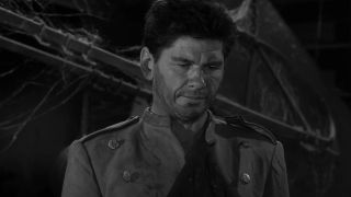 Charles Bronson looking down in The Twilight Episode Two