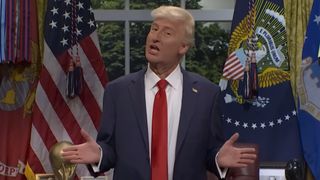 James Austin Johnson dressed as Donald Trump speaks in the Oval Office.