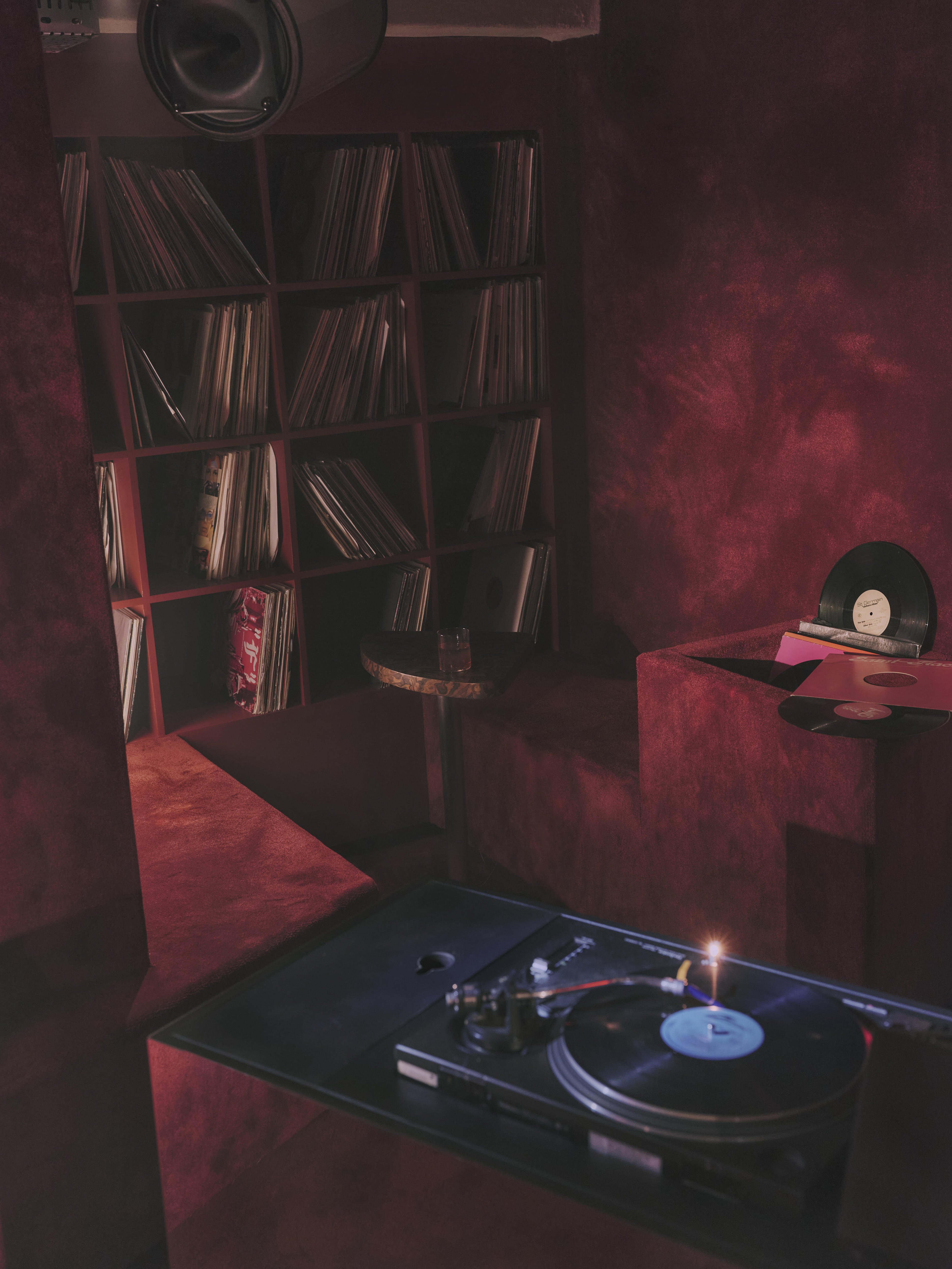 view of an underground bar in london defined by low lighting and velvet textures