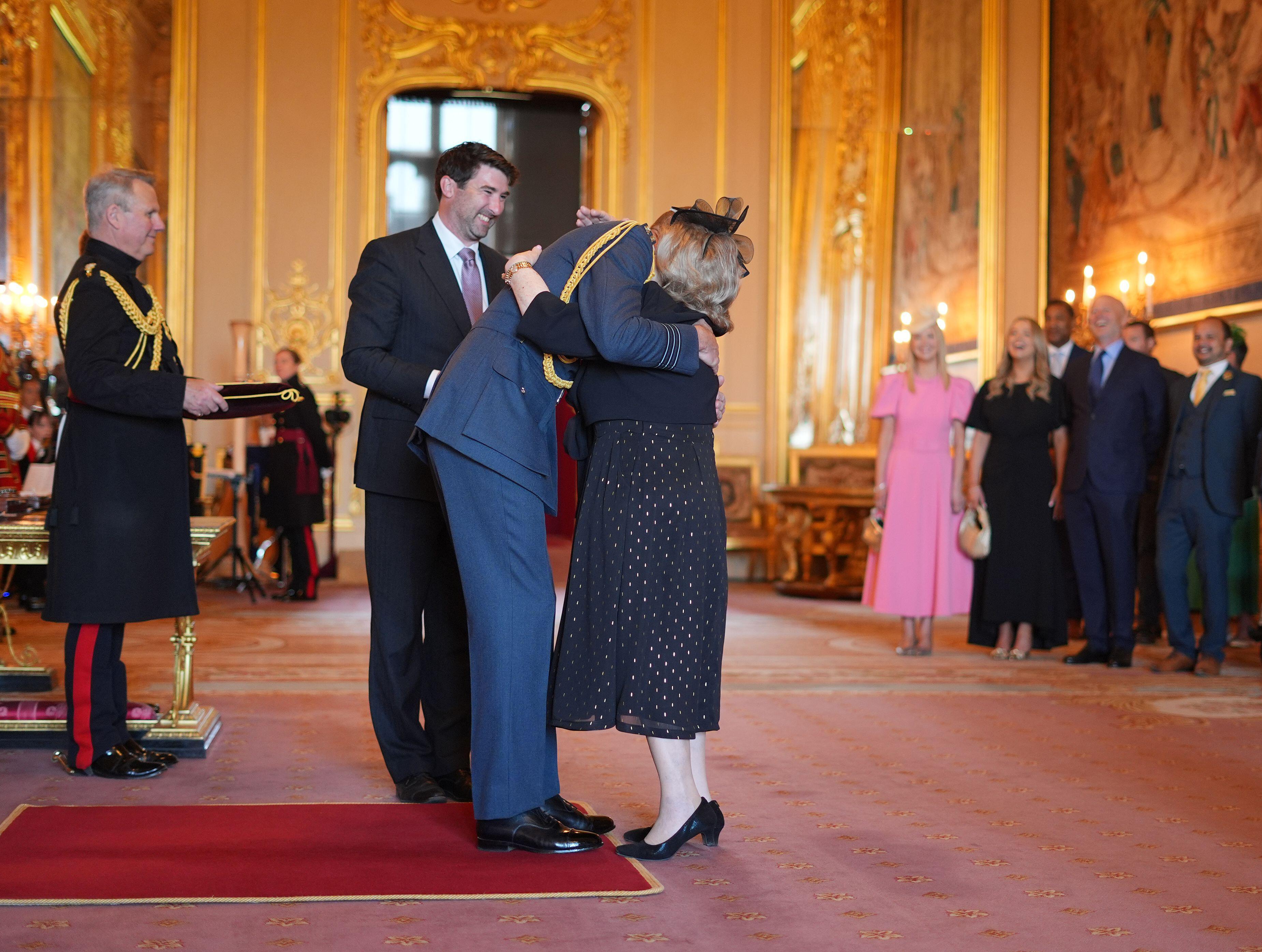Prince William hugging teacher Wendy Daunt at an investiture