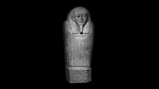 The lid of Psamtik's sarcophagus is carved from a single slab of stone covered with engravings of protective spells.