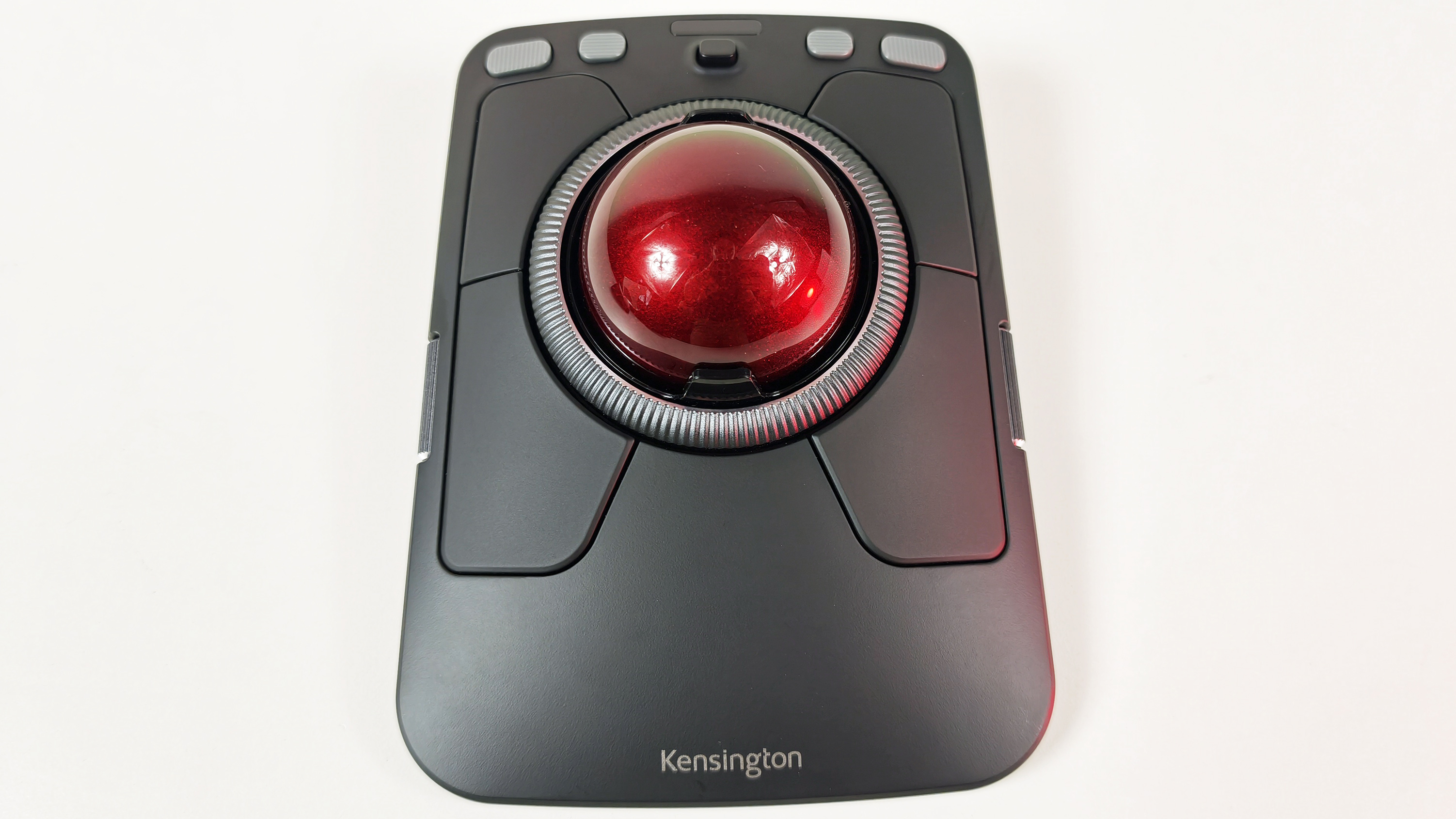 Top-down view of the Kensington Expert Mouse Pro TB900 EQ trackball, showing its symmetrical design, 55mm red ball, scroll ring, and multi-button layout.