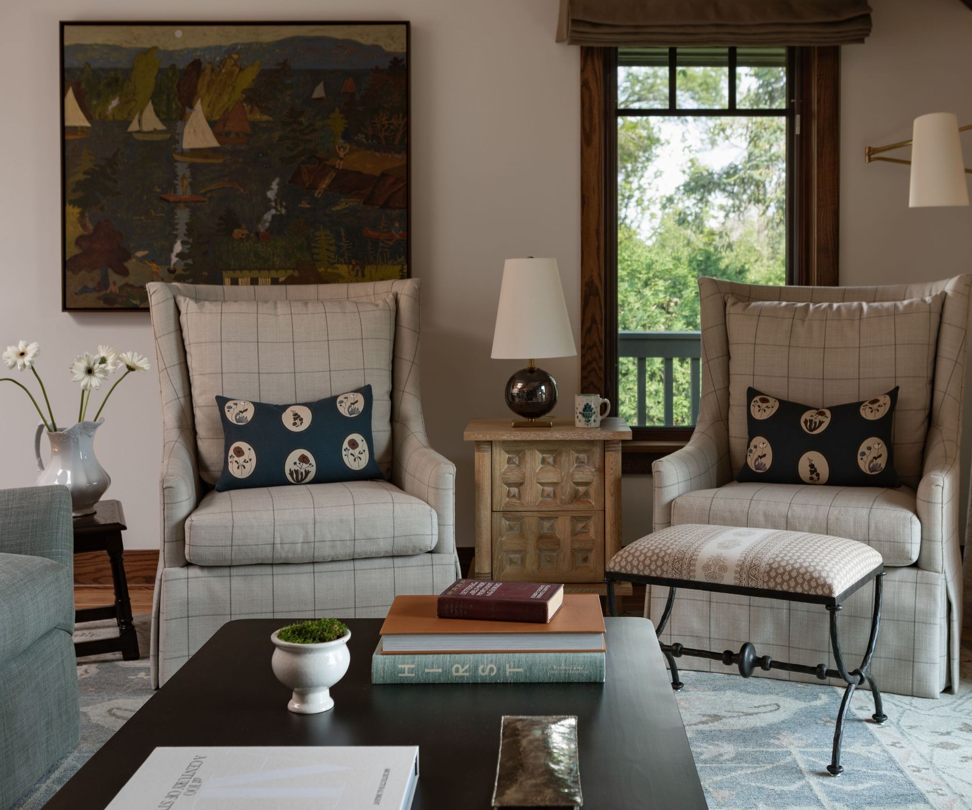 cozy living room for two with matching armchairs and large abstract artwork
