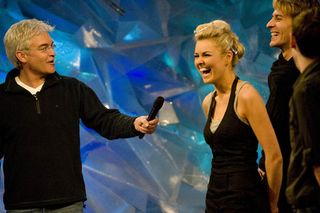 There's always time for a laugh on set. Here, Phillip brings a grin to former Blue Peter presenter Zoe Salmon's face