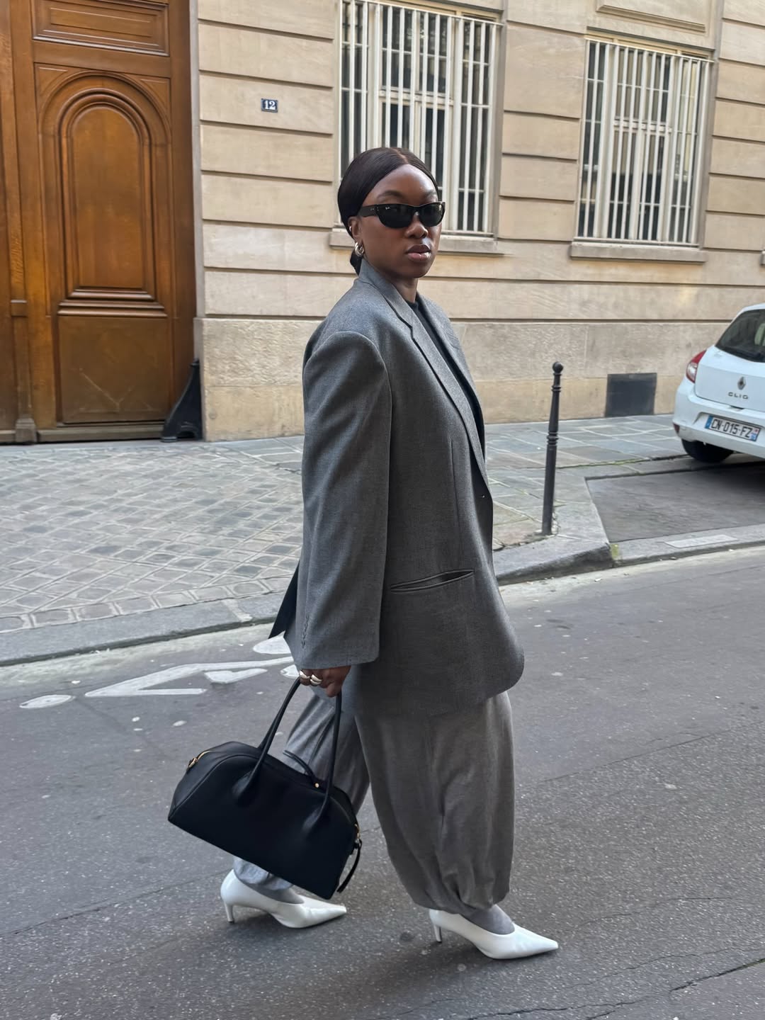 Nnenna wearing grey balloon trousers