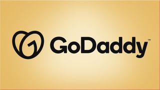 GoDaddy logo keltaista taustaa vasten