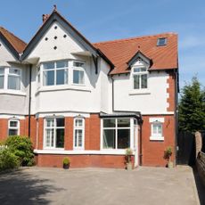 front of semi detached house with red and white brick