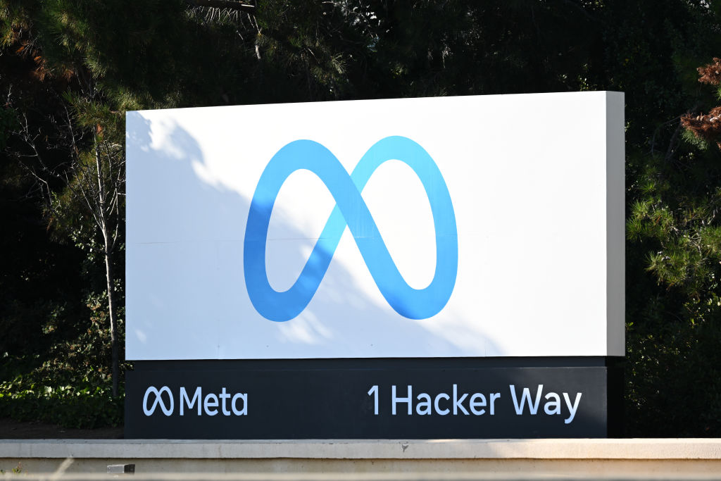 Meta sign with 1 Hacker Way address.