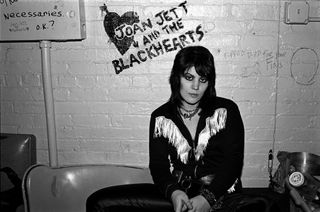 Joan Jett sits backstage in New York City in 1981