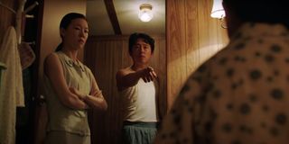 Miniari Steven Yeun sternly talking to his son at bedtime