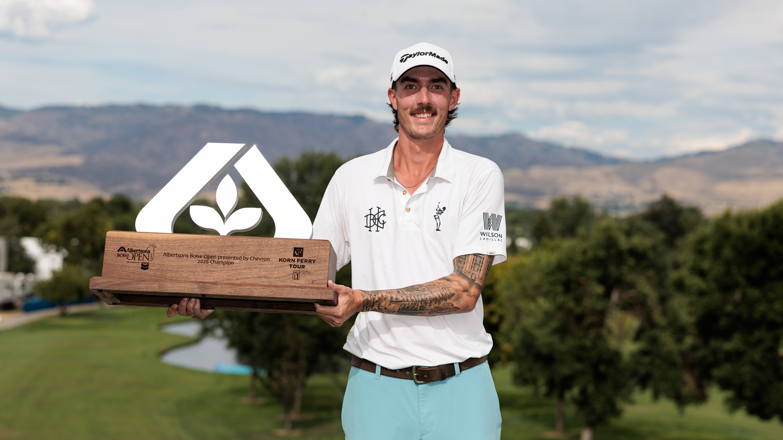 Ross Steelman holds a trophy