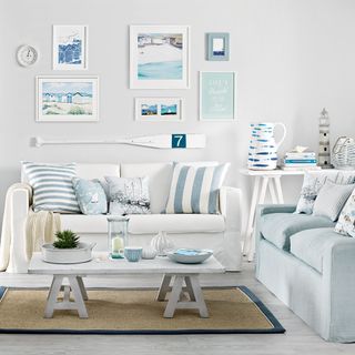 living room with white watch sofa and cushion