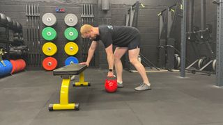 TechRadar fitness writer Harry Bullmore performing a kettlebell single-arm row