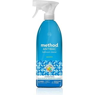 Method Antibacterial Bathroom Cleaner, Spearmint, in a deep blue spray bottle