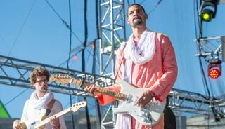 Mikey Coltun (left) and Mdou Moctar perform on the Hydro Quebec stage at Place D'Youville during Day 4 of the 52nd Festival D'été Quebec on July 7, 2019 in Quebec City, Canada