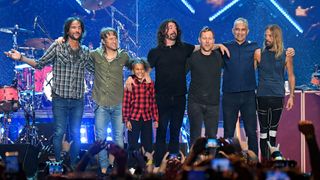 Nandi Bushell on stage with the members of Foo Fighters