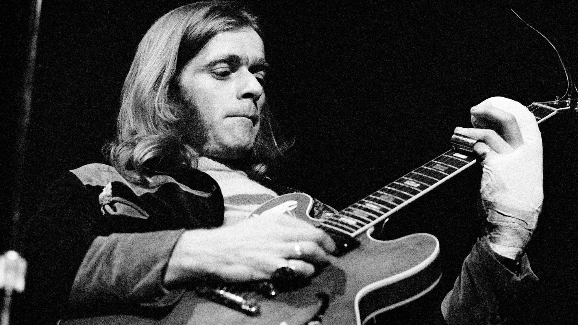 British guitarist Henry McCullough performs live on stage with The Grease Band 