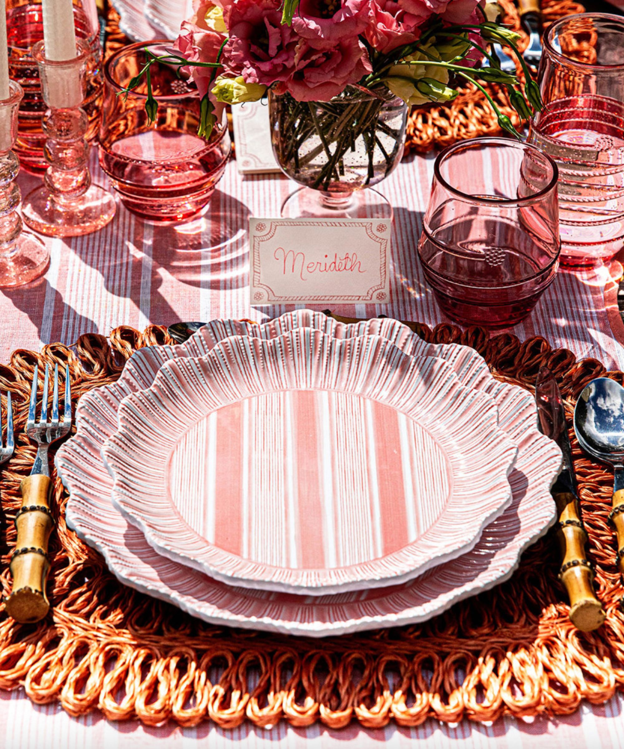Birch Lane Cabana stripe melamine dinnerware in pink and white stripe with rattan placemat, bamboo flatware and pink glassware