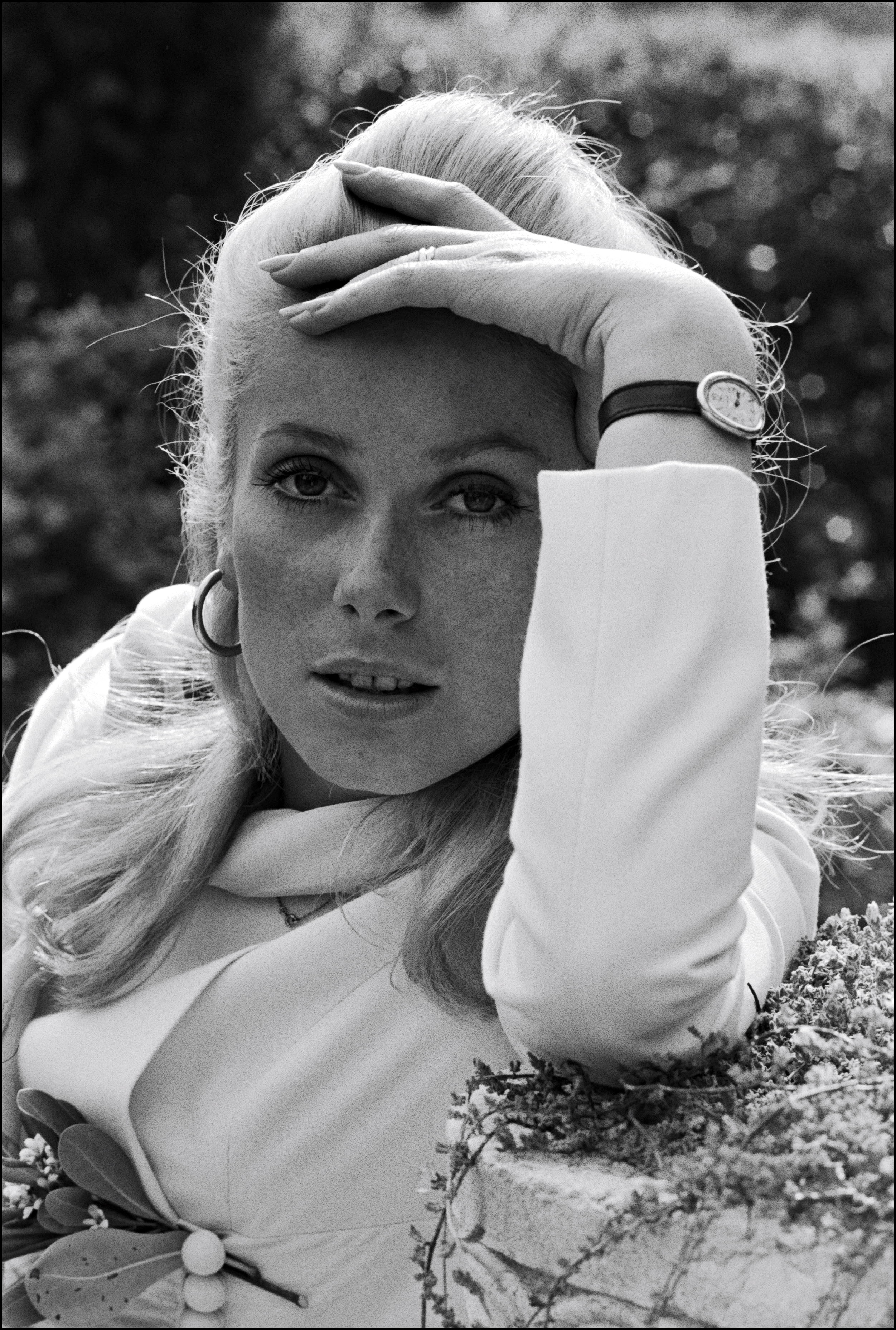 Catherine Deneuve wears the Cartier Baignoire in Cannes, France on May 24, 1965.