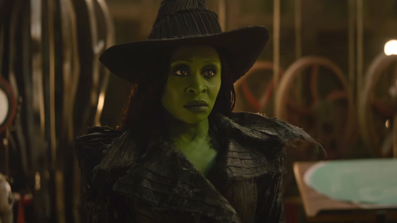 Cynthia Erivo stands in the Wizard's lair with a look of uncertainty in Wicked: For Good.