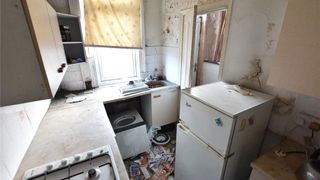 Neglected kitchen in two-bed house for sale