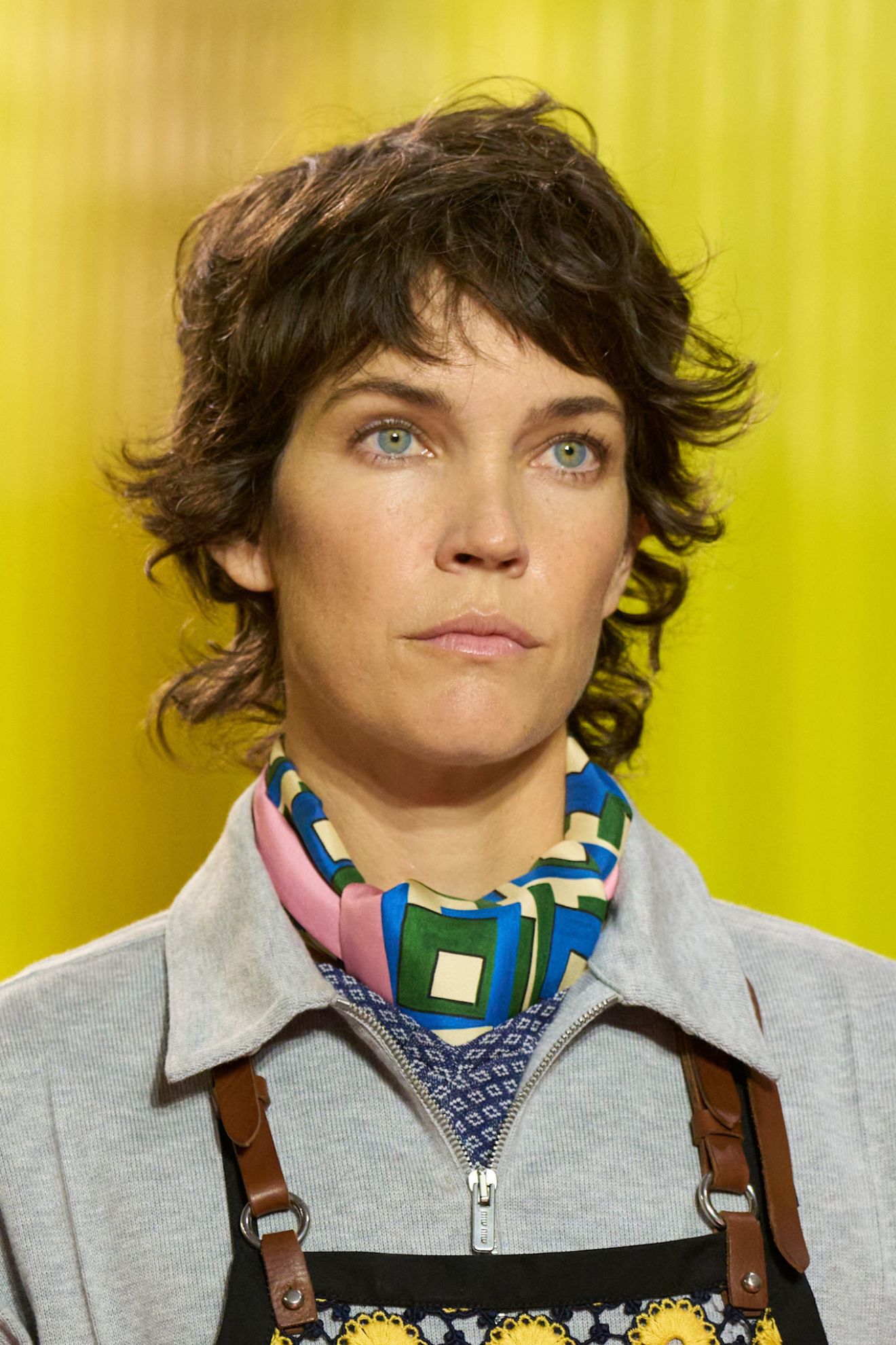 A model at the SS26 Paris Miu Miu show with a shaggy hairstyle